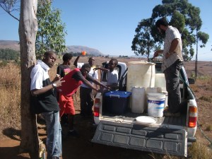 Fetching water in order to plaster Tholakele's house