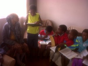 Kids reading their bibles.