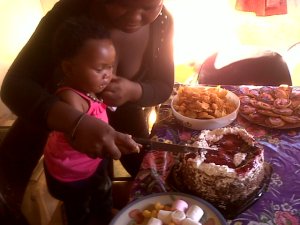 Neighbour's party for baby girl. At the Sithole homestead.