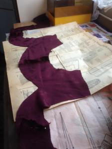 Celani cuts her material