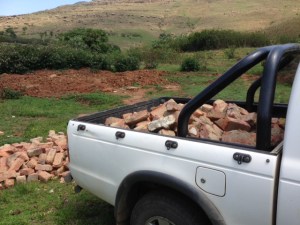Helping Mkhulu fetching his bricks so he can build in the future