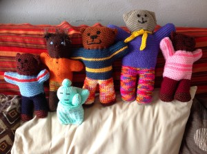 Family of knitted toys needing a home