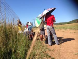 People listening to the gospel in the heat of the day