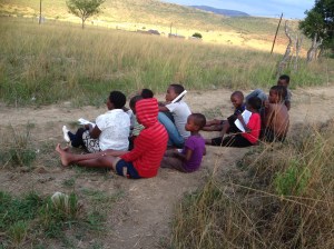 A little crowd listening to the Gospel.
