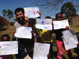 Salvador teaches the little kids on the lost sheep.