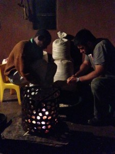 Helping Phumlani pluck mealies